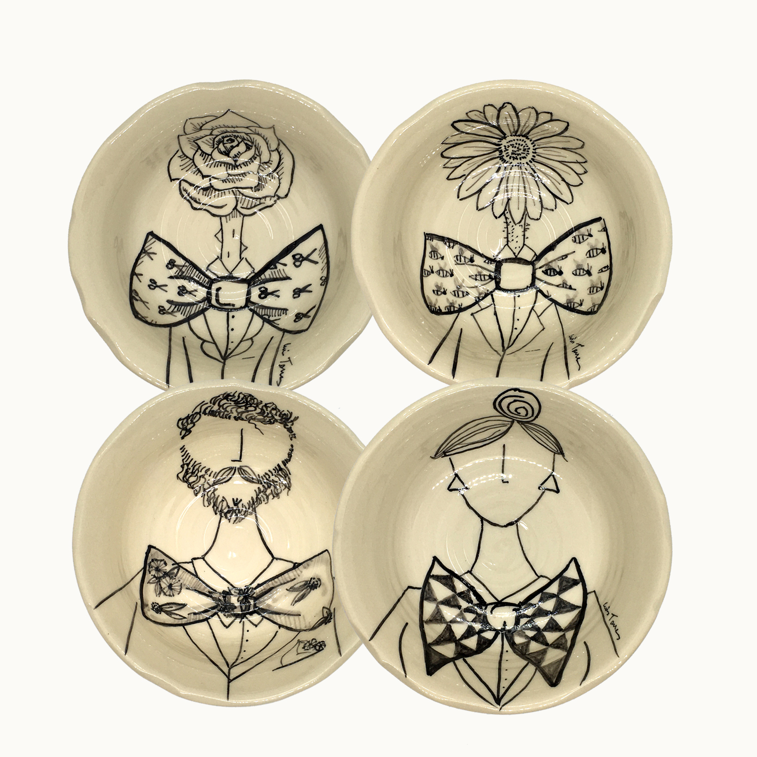 Juego de cuatro Cuencos hechos e ilustrados a mano por Luis Torres Ceramics en La Rambla Córdoba con diseño de flores, chico y chica con pajarita. Set of four Handmade ceramic illustrated bowls with design of flowers, cat and dog with bow tie.